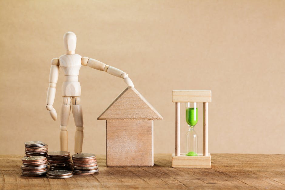 Wooden mannequin with house model, coins, and hourglass symbolizing financial planning.