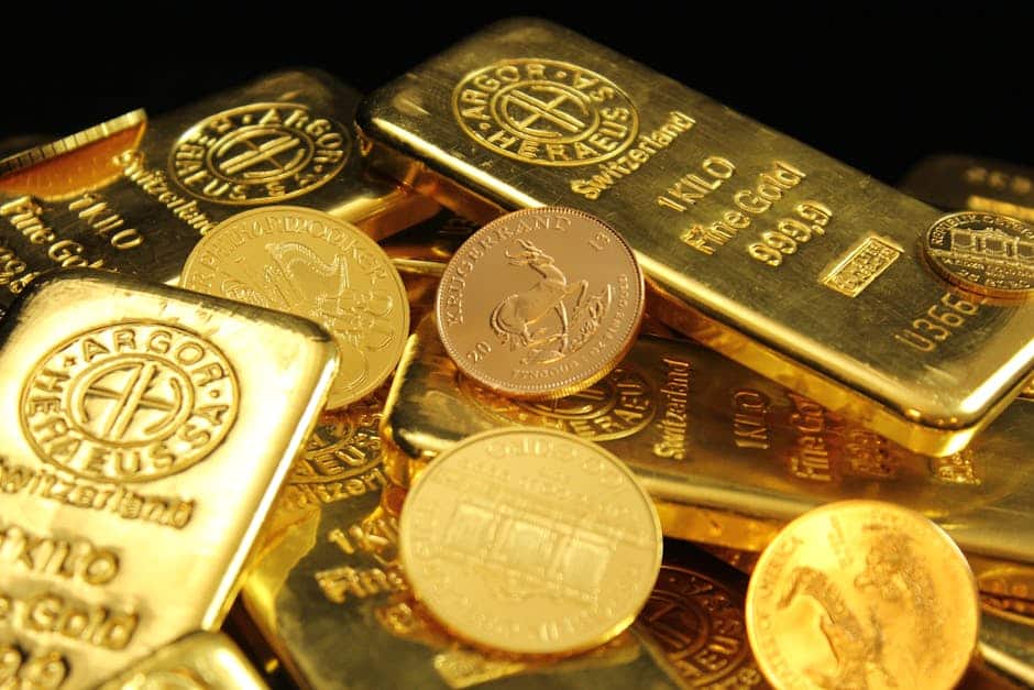 A detailed image of gold bars and coins symbolizing wealth and financial investment.