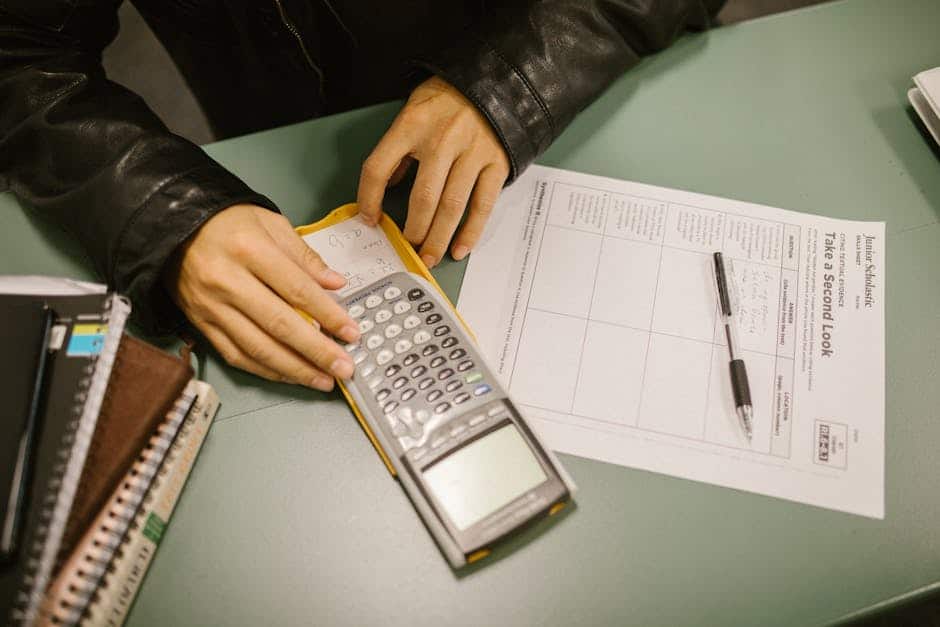 A student covertly uses a cheat sheet hidden in a calculator during an exam.
