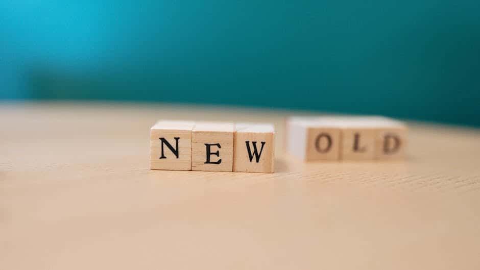 Wooden blocks displaying the words 'NEW' and 'OLD', symbolizing change.