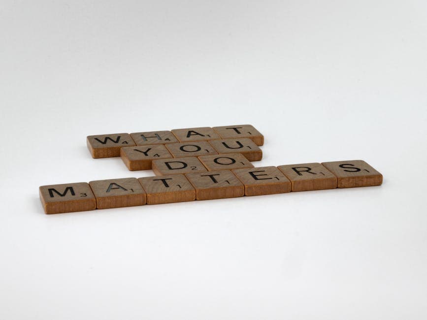 Scrabble tiles form the motivational phrase 'What You Do Matters' on a white background.
